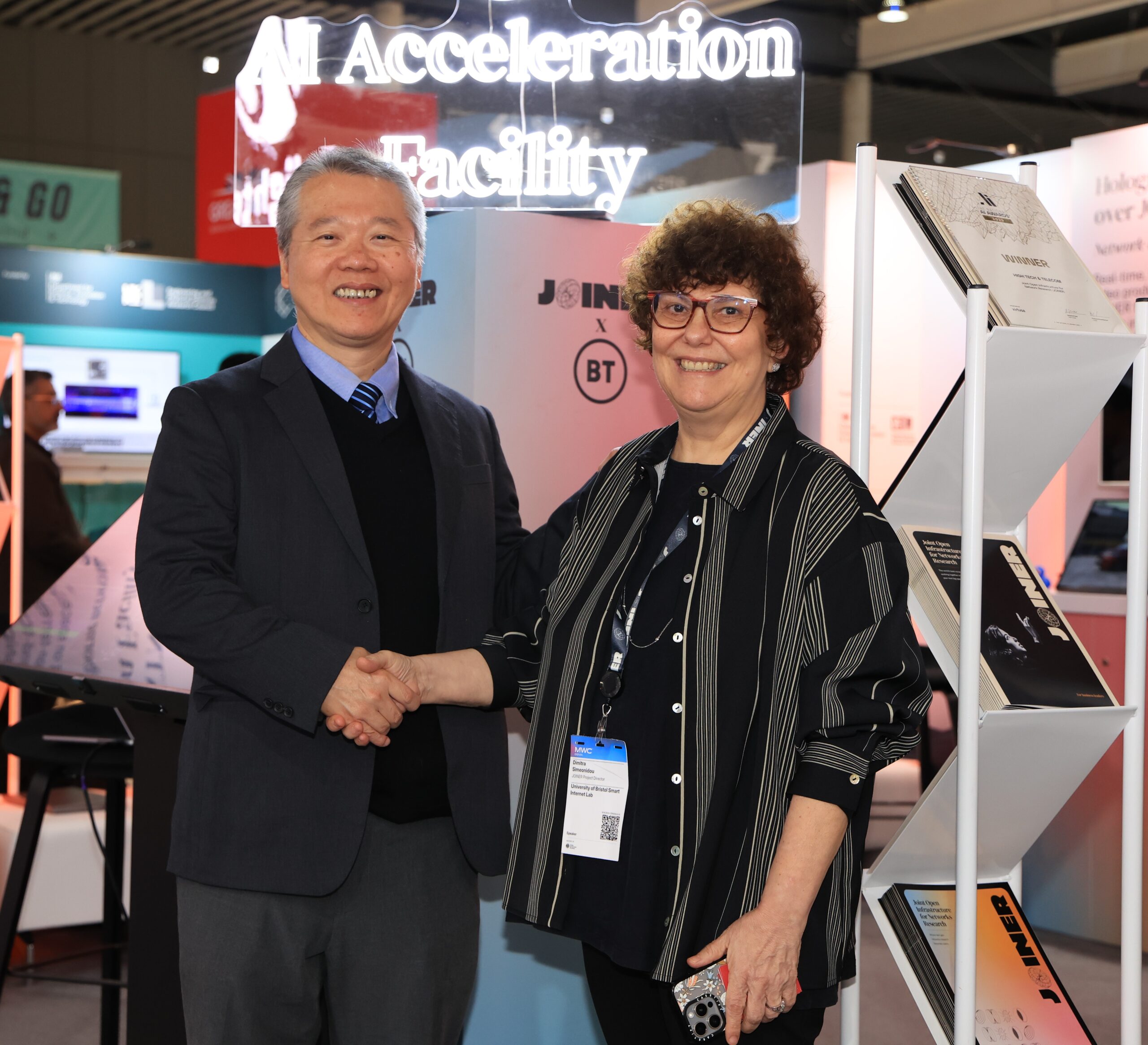 JOINER lead, Professor Dimitra Simeonidou OBE, FREng, FIEEE and Dr. Ting - shaking hands